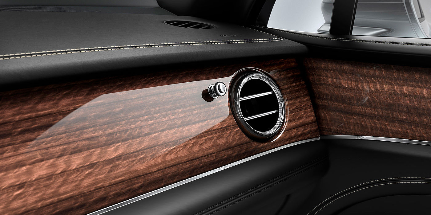 Bentley Beijing - Sanlitun Bentley Bentayga front interior Crown Cut Walnut veneer and chrome air vent.